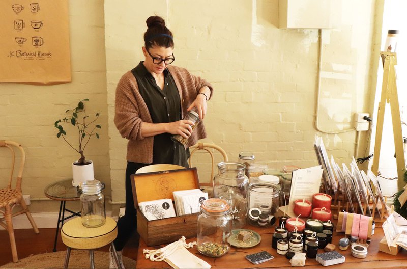 Nellie is opening a jar of herbs